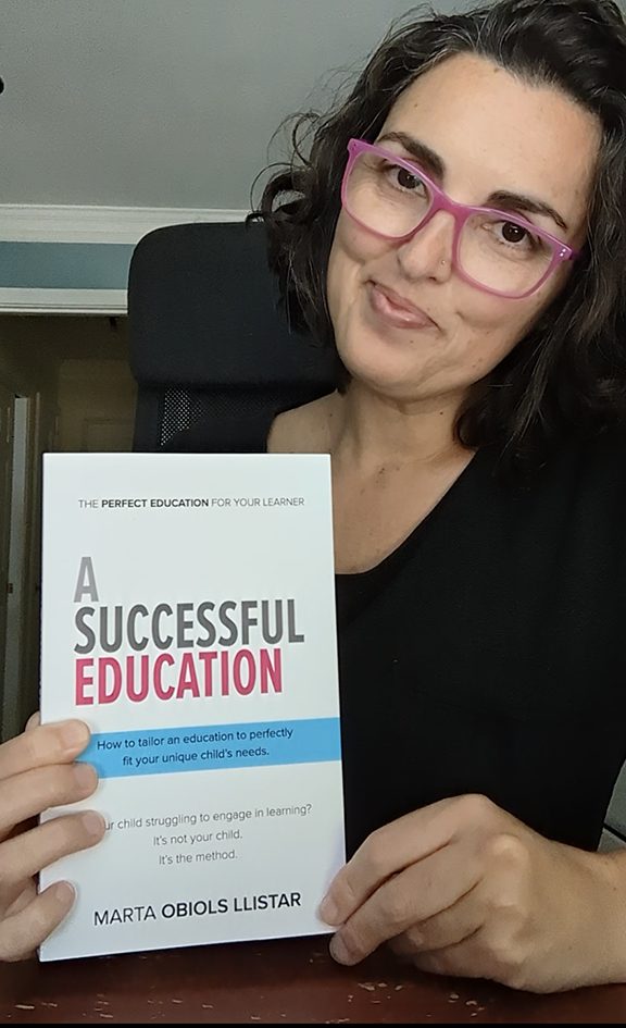 Marta Obiols Llistar holds her newly released book, A Successful Education.