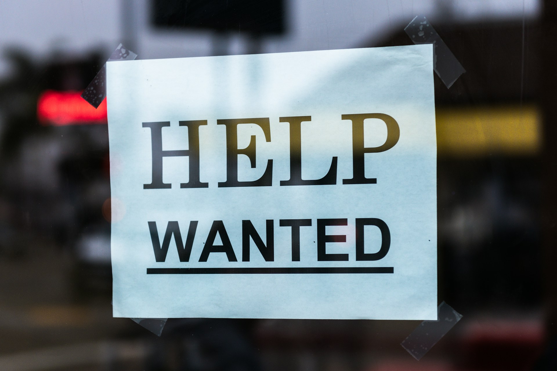 Image shows a help wanted sign to illustrate tips to publish your self-help book