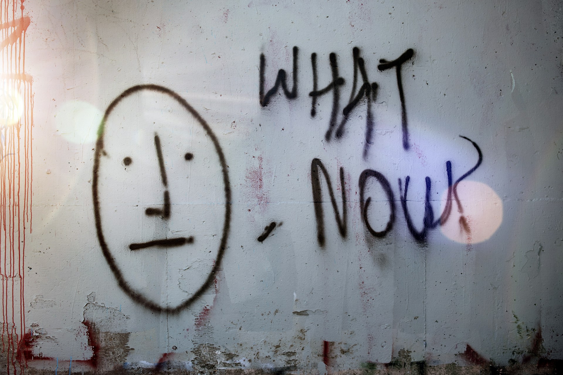 Image shows graffiti that reads "What now?" to illustrate the idea that writers aren't sure what to do after their manuscript is rejected by a publisher.